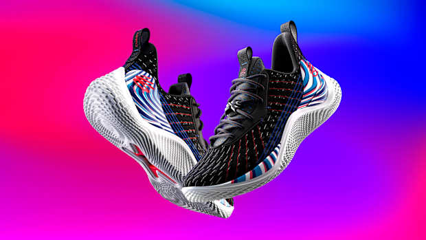 View of black and white Curry shoes.